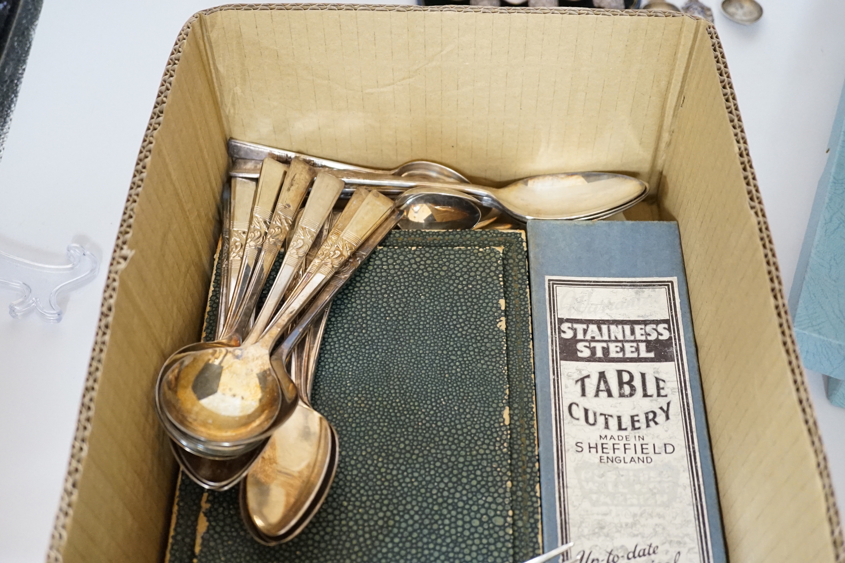 Assorted plated flatware and three silver commemorative spoons